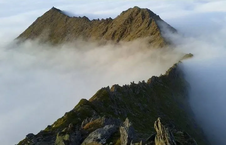A rocky ridge on the MacGillycuddy's Reeks rising above a sea of cloud